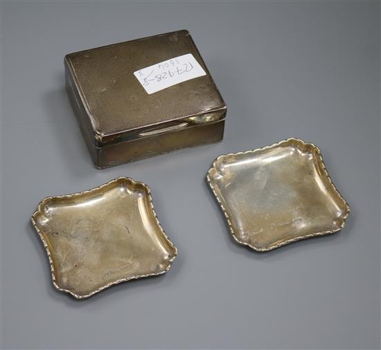 A George V cigarette case and a pair of shaped square trays.